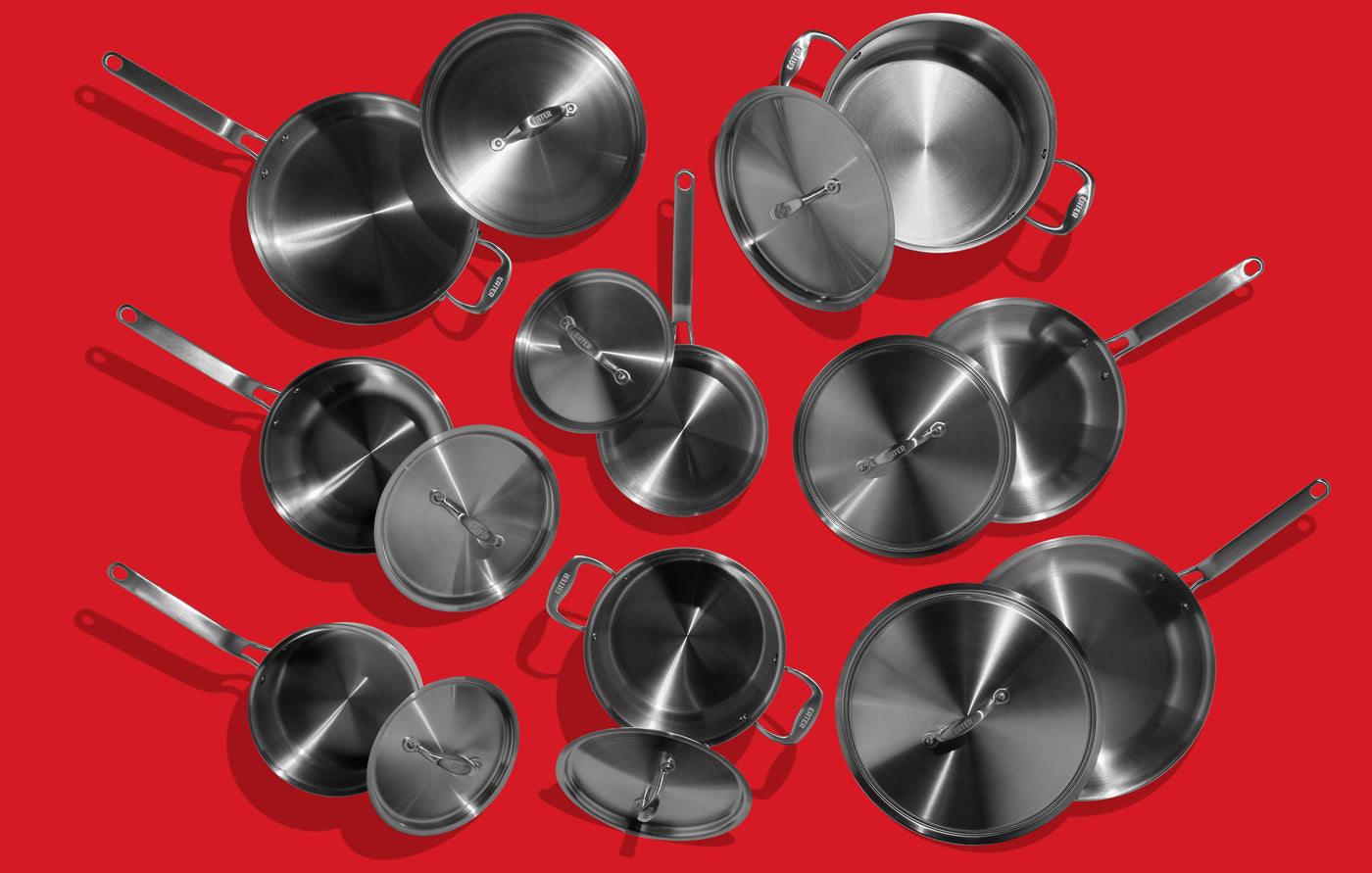 16 piece cookware set on red background